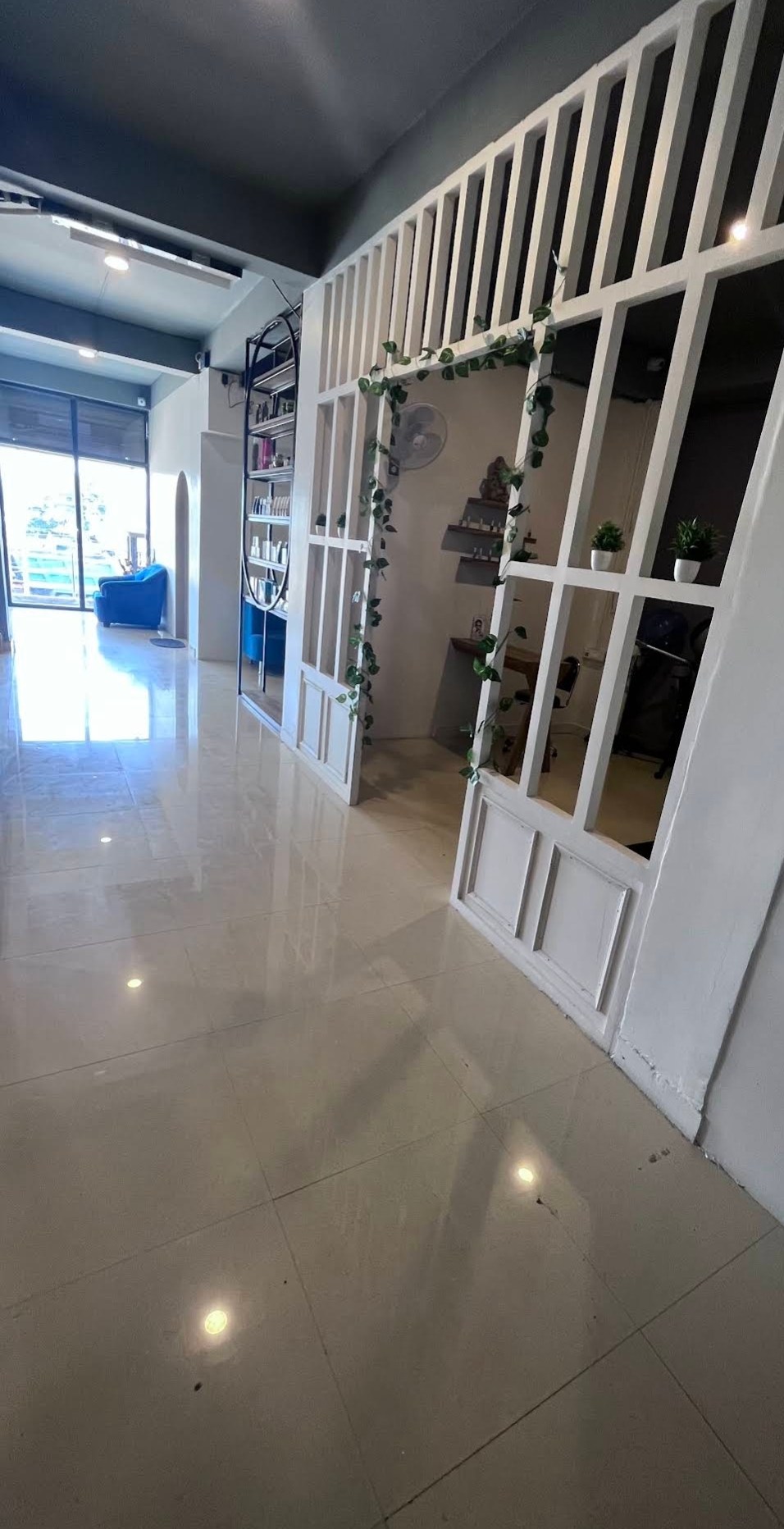 Main salon floor with black chairs